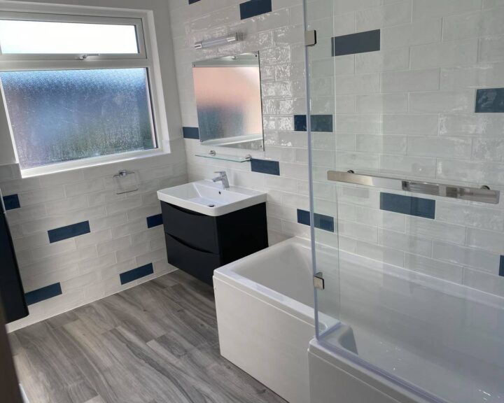A Southampton bathroom with blue and white tiled walls.