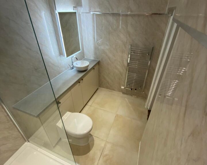bathroom-fitters-southampton-7 A bathroom design in Southampton featuring a toilet, sink, and shower.